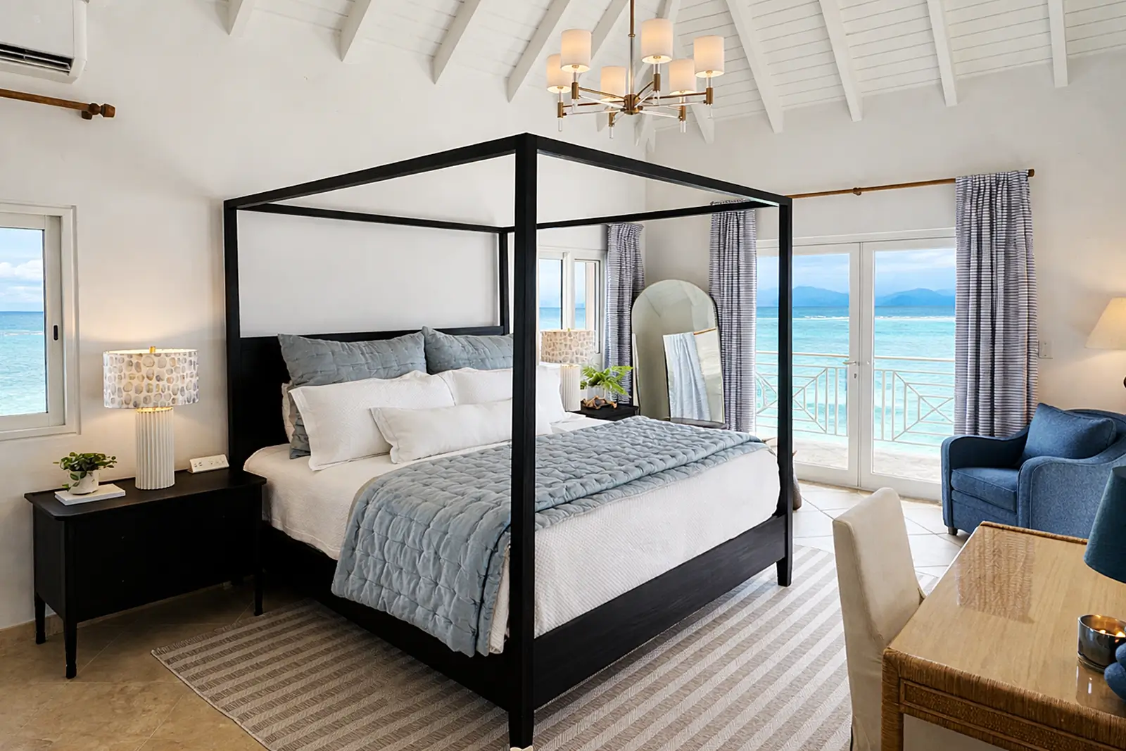 Water's Edge bedroom — ocean views and refined coastal comfort